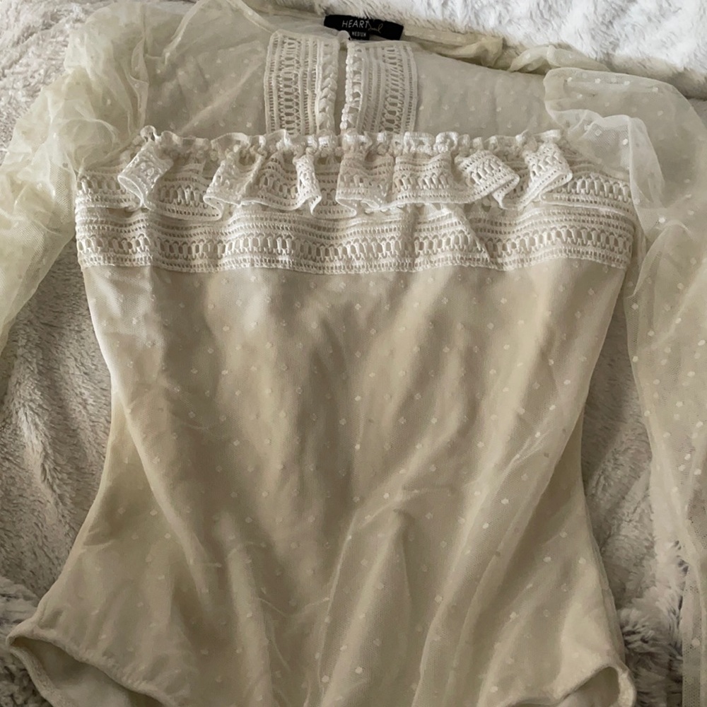 White and skin colored bodysuit